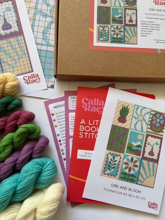 Grid and Bloom Cross stitch kit contents including Appleton wool hanks, pattern charts, instructions and packaging by Calla Rae Studio